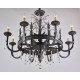 Black chandelier with silver spots and crystal decoration . 