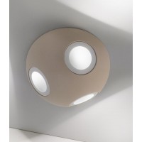 Ceiling lamp made of extremely light material with three light sources that diffuse in the space. Available in 3 colors.